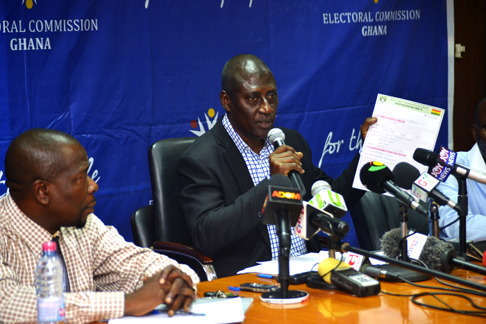 Mr Samuel Tetteh, Director of Electoral Services of theElectoral Commission (EC), showing a registration form to journalists, during a press briefing on the modalities for deletingNHIS names from the voters register at the Conference Hall of the EC. To his right is Mr Eric Kofi Dzakpasu, Head of Communications of the EC. Picture: EMMANUEL QUAYE